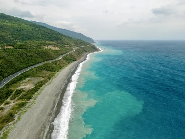East coast road and turquoise sea aerial