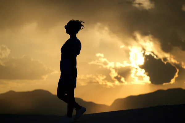Jenny silhouette at sunset, White Sands